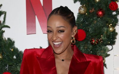 Who’s That Sis!? Tia Mowry Sparks Questions After Mystery Hand Appears In Her Selfie