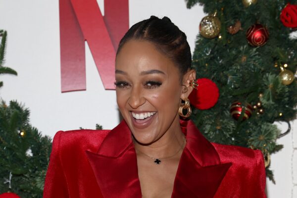 Who’s That Sis!? Tia Mowry Sparks Questions After Mystery Hand Appears In Her Selfie