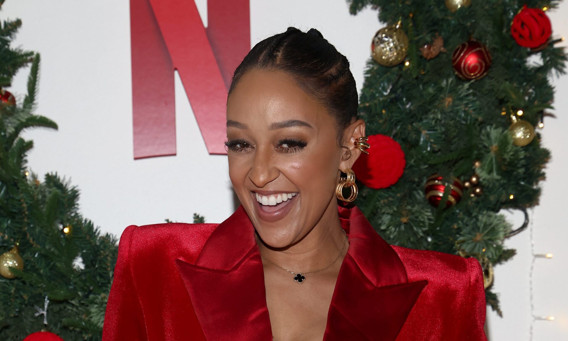 Who’s That Sis!? Tia Mowry Sparks Questions After Mystery Hand Appears In Her Selfie