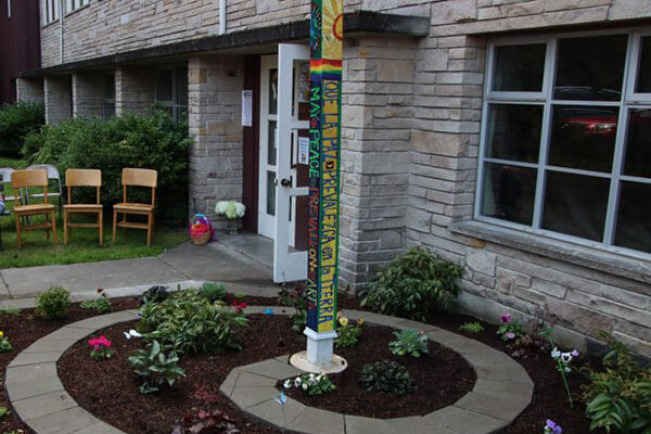 Peace Pole planted at Children’s Peace Garden outside Fauntleroy Church, West Seattle, Washington State, USA