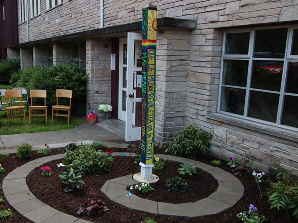 Peace Pole planted at Children’s Peace Garden outside Fauntleroy Church, West Seattle, Washington State, USA