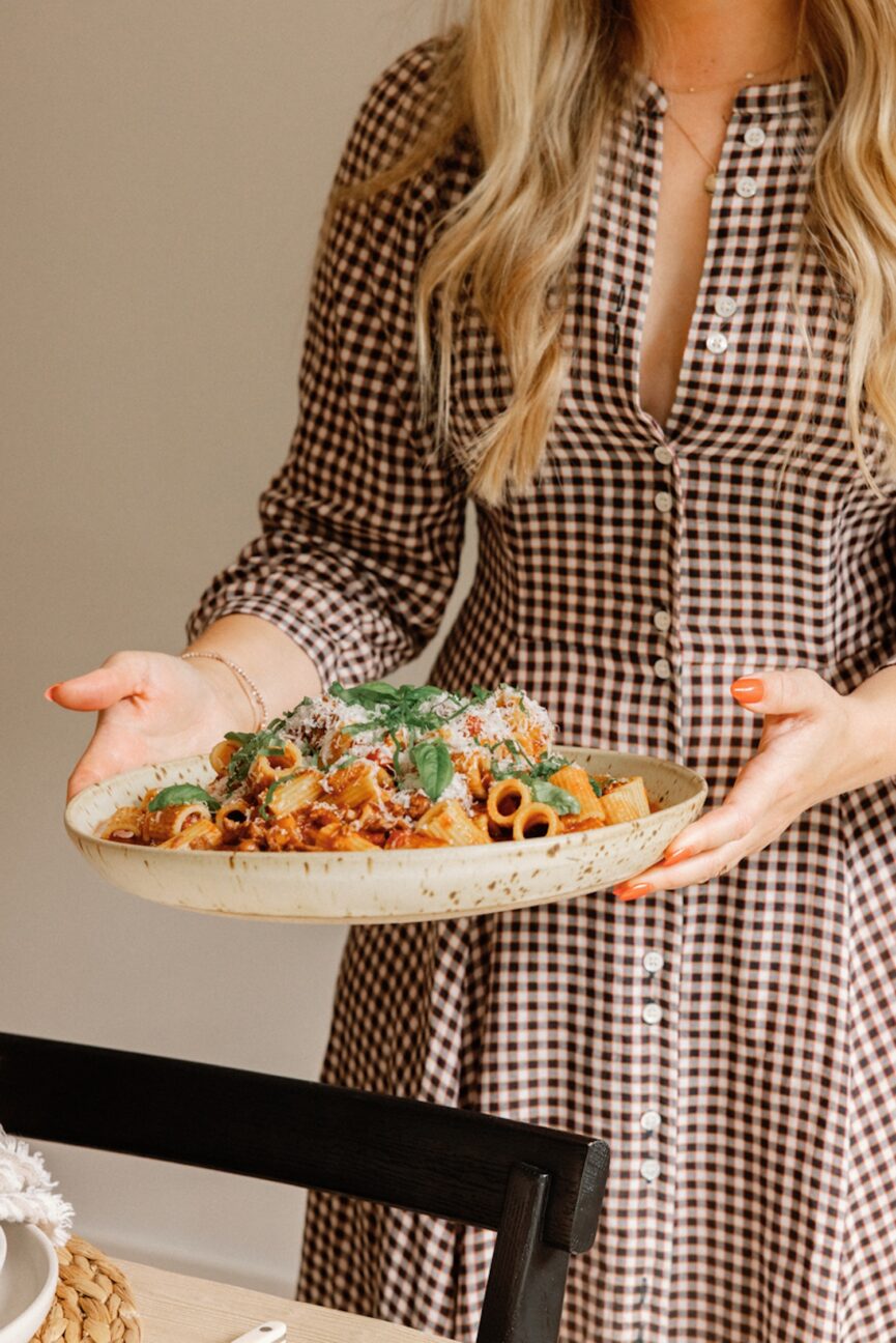 Woman serving cozy, easy winter recipes.