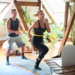 What Is the Murph Workout? Rules and How to Prepare - Spirit Web a-couple-working-out-on-yoga-mats-indoors-using-a-laptop-for-guidance-8173442-1024x684-1