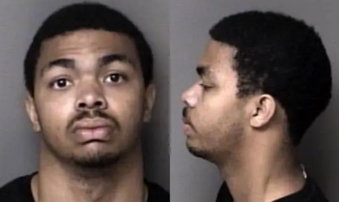 Mugshot of a young man showing front and side profiles against a neutral background, highlighting facial features and hairstyle.