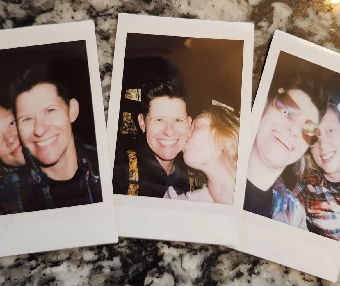 Three polaroid photos of two friends sharing joyful moments, featuring smiles, a kiss, and playful expressions on a textured surface.