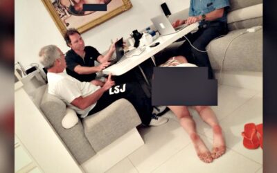 BUSINESS MEETING, EPSTEIN STYLE: Disturbing Photo Shows Epstein and Associates Working as Bikini-Clad Woman Crawls Under the Table