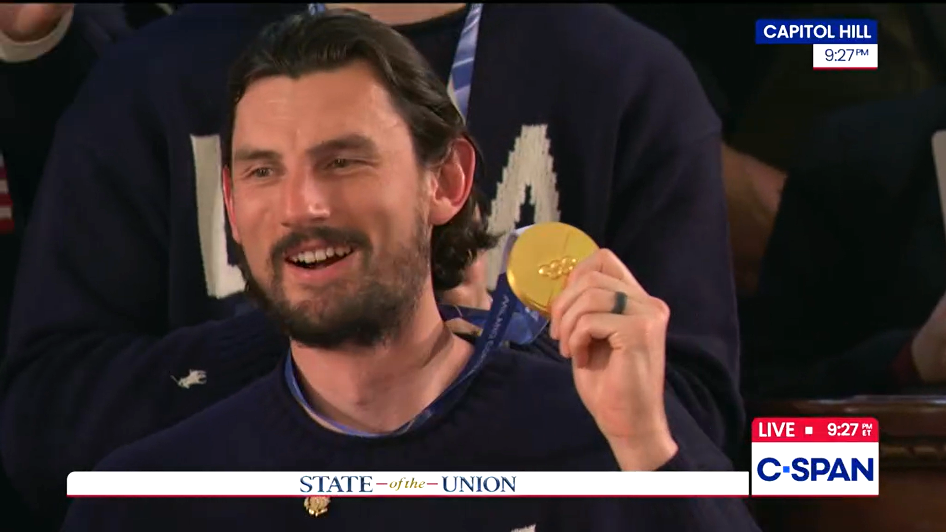 Goalie Connor Hellebuyck hears he will be awarded the Medal of Freedom.