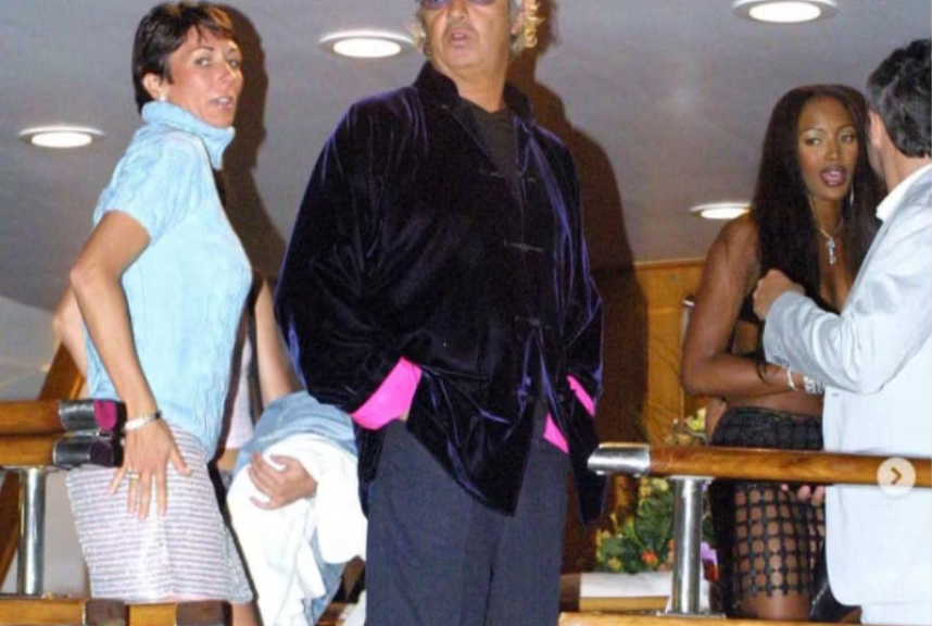 A group of stylish individuals socializing at a glamorous event, featuring a man in a velvet jacket and two women in fashionable outfits.