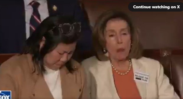 Nancy Pelosi and another woman sitting together, displaying emotional expressions during a significant event in the U.S. Congress.