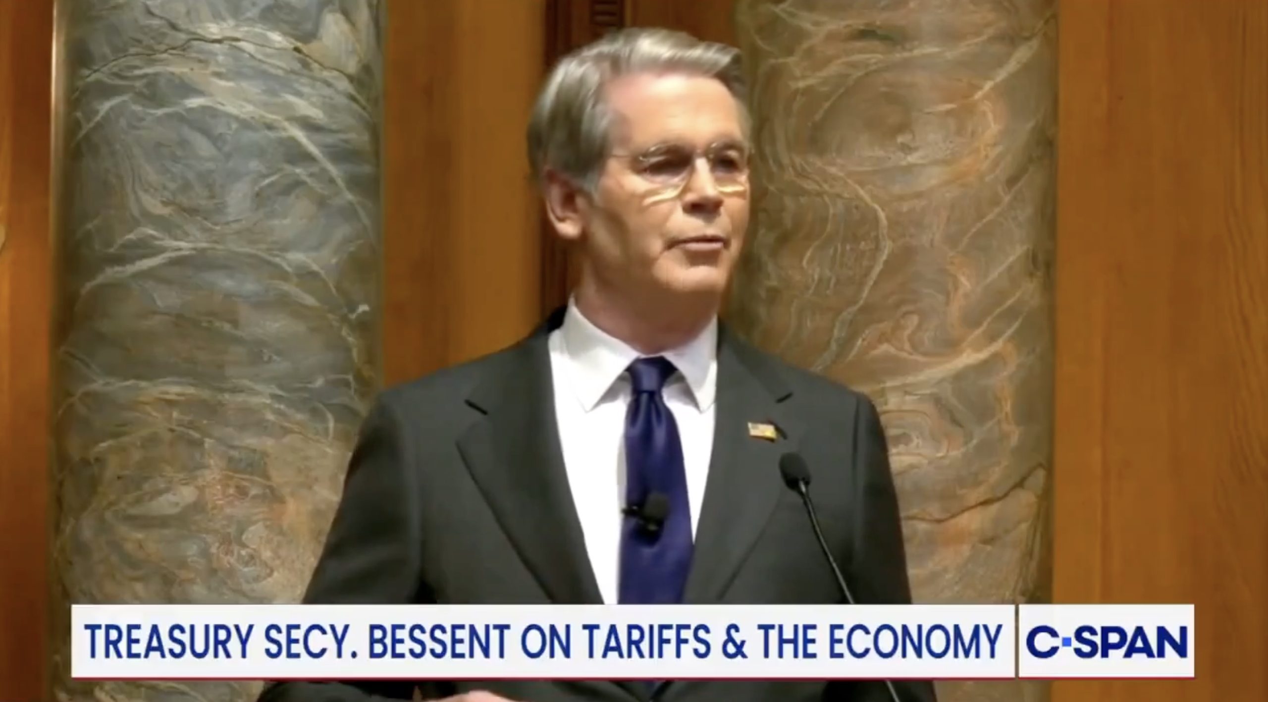 Treasury Secretary discussing tariffs and their impact on the economy during a public address.