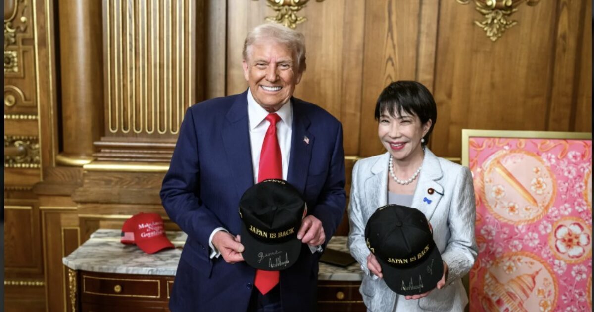 Donald Trump and a woman hold matching "Japan is Back" hats in an ornate room, symbolizing a diplomatic meeting between the U.S. and Japan.