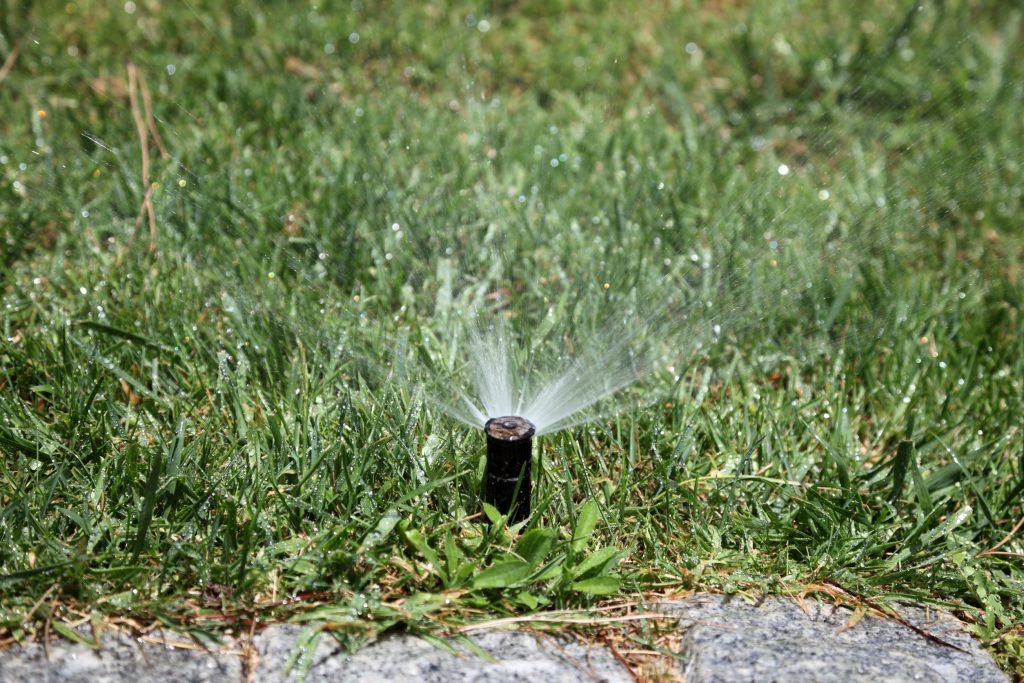 When to turn sprinklers on after winter (and how to avoid costly damage to lawn and home)