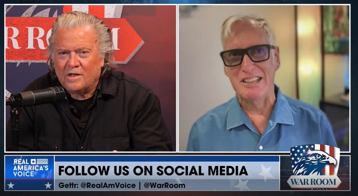 Steve Bannon and a guest discuss current events on the War Room show, featuring a backdrop with social media handles and a patriotic theme.