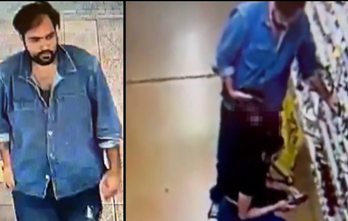 Surveillance footage showing a man in a blue denim shirt and a woman in a black shirt in a retail store aisle.