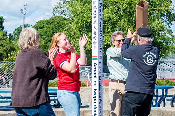 Planting a Peace Pole at Analy, Sebastopol, California, USA.