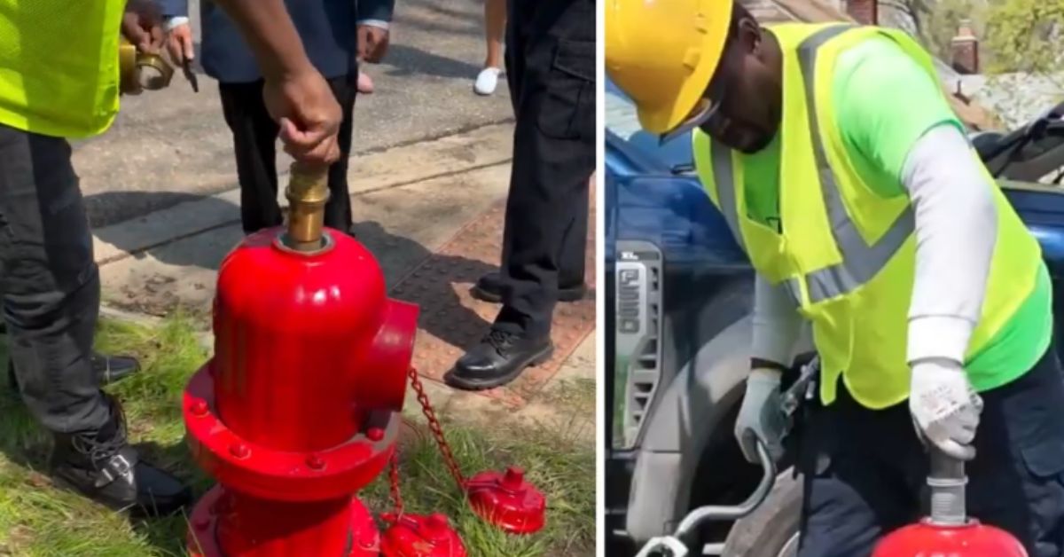 Workers operating a red fire hydrant, demonstrating maintenance procedures with safety gear in an outdoor setting.