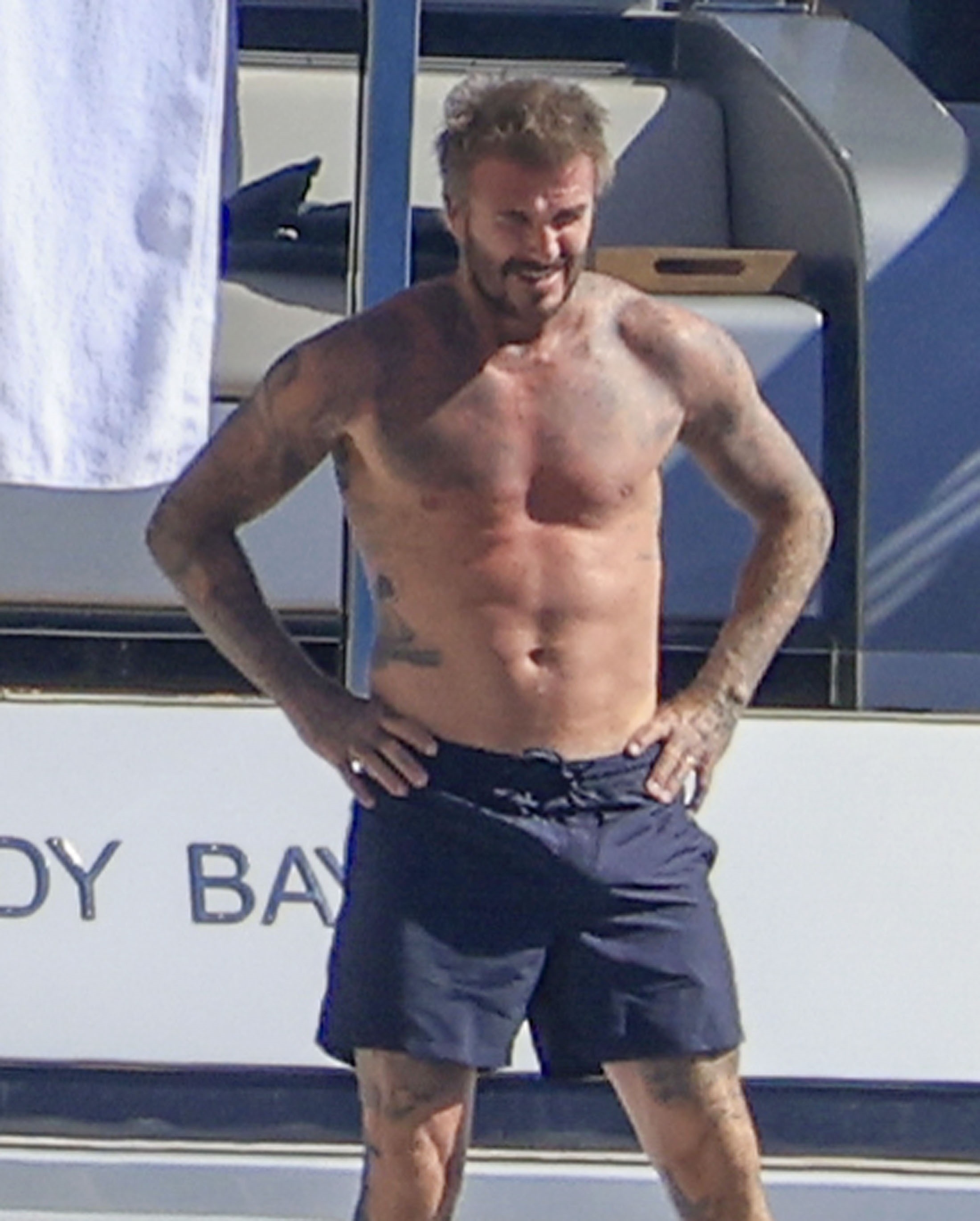 David Beckham and Victoria Beckham relaxing on a yacht in Ibiza