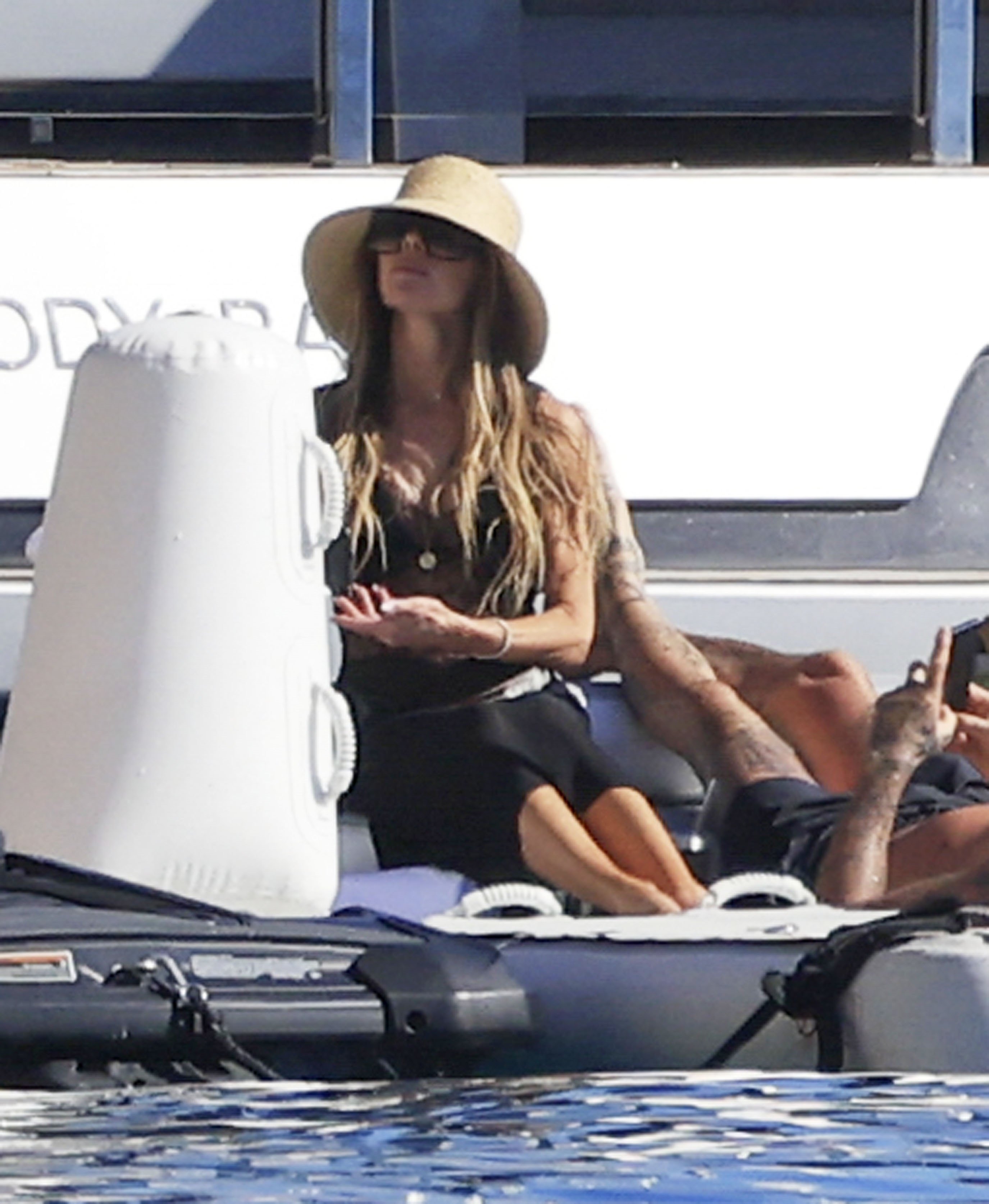 David Beckham and Victoria Beckham relaxing on a yacht in Ibiza