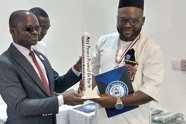 New Ambassador of Peace receives Peace Pole, Nigeria, Africa.