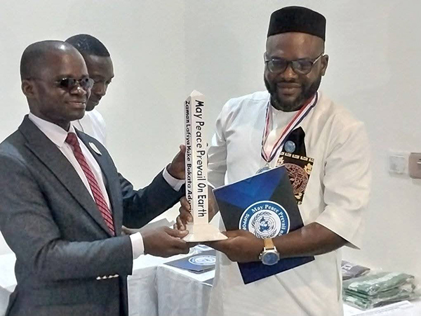 New Ambassador of Peace receives Peace Pole, Nigeria, Africa.