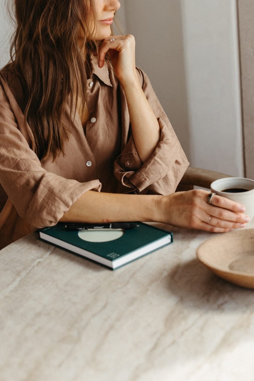 Camille Styles journaling about spring habits to feel better by summer