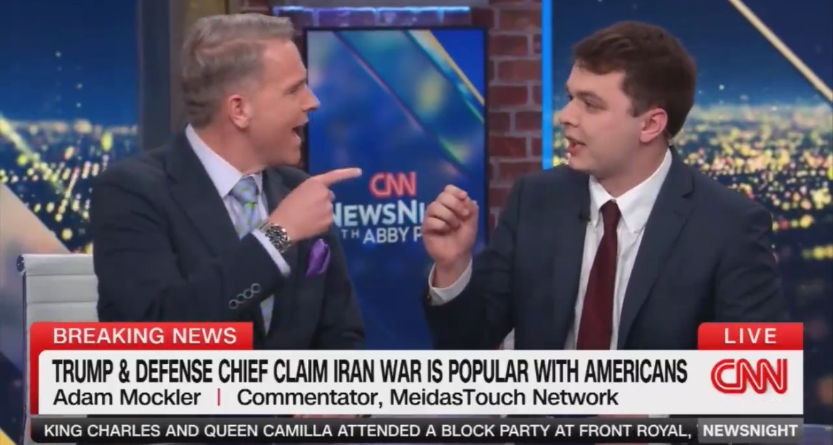 Two commentators engage in a heated debate about the popularity of a potential Iran war among Americans on a CNN news segment.