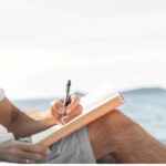 The Joy of Being Stupid AdobeStock_man-writing-peacefully-alone