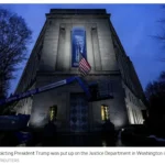 Banner-on-DOJ-Trump