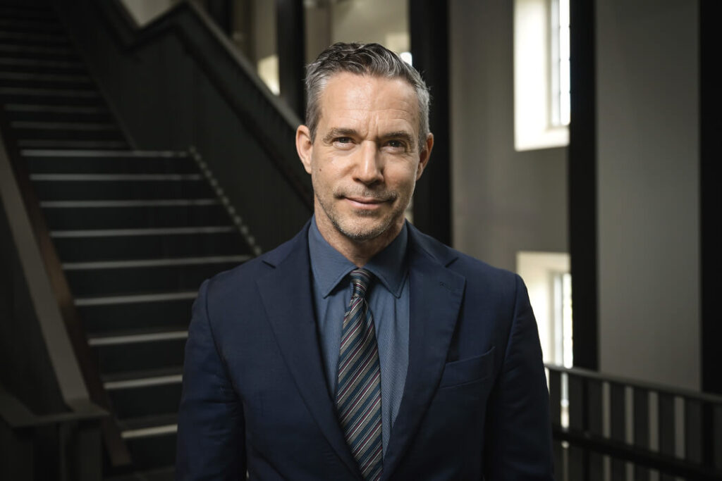 A headshot of Brian McQuinn