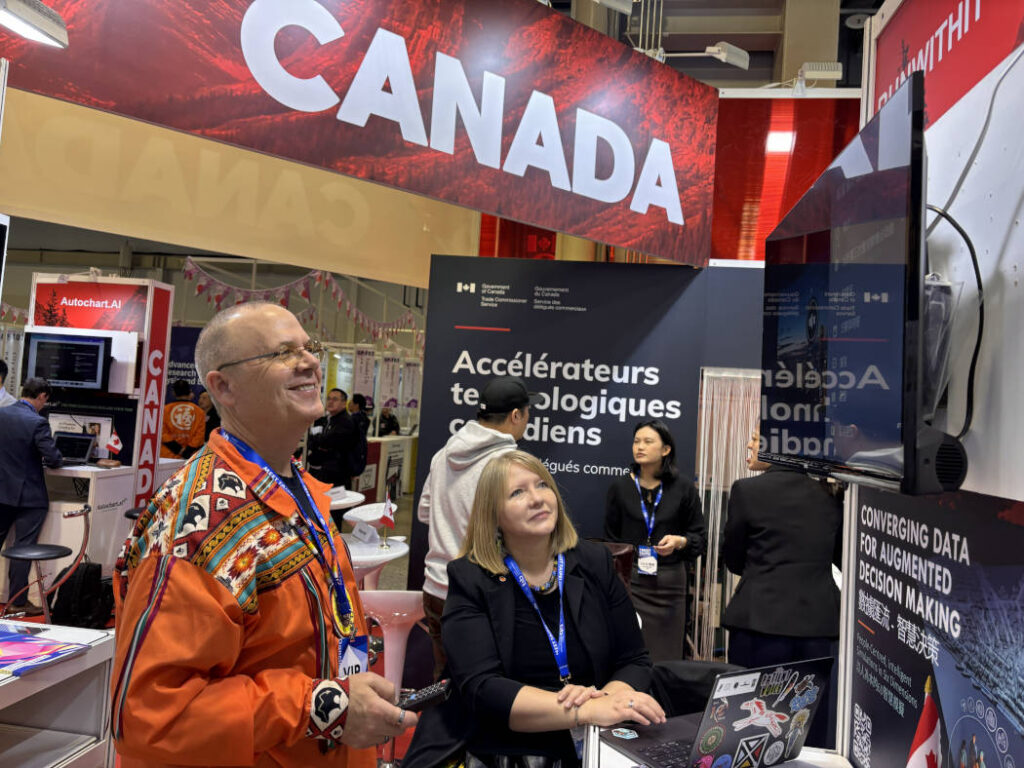Dean and Myrna at a Canada booth