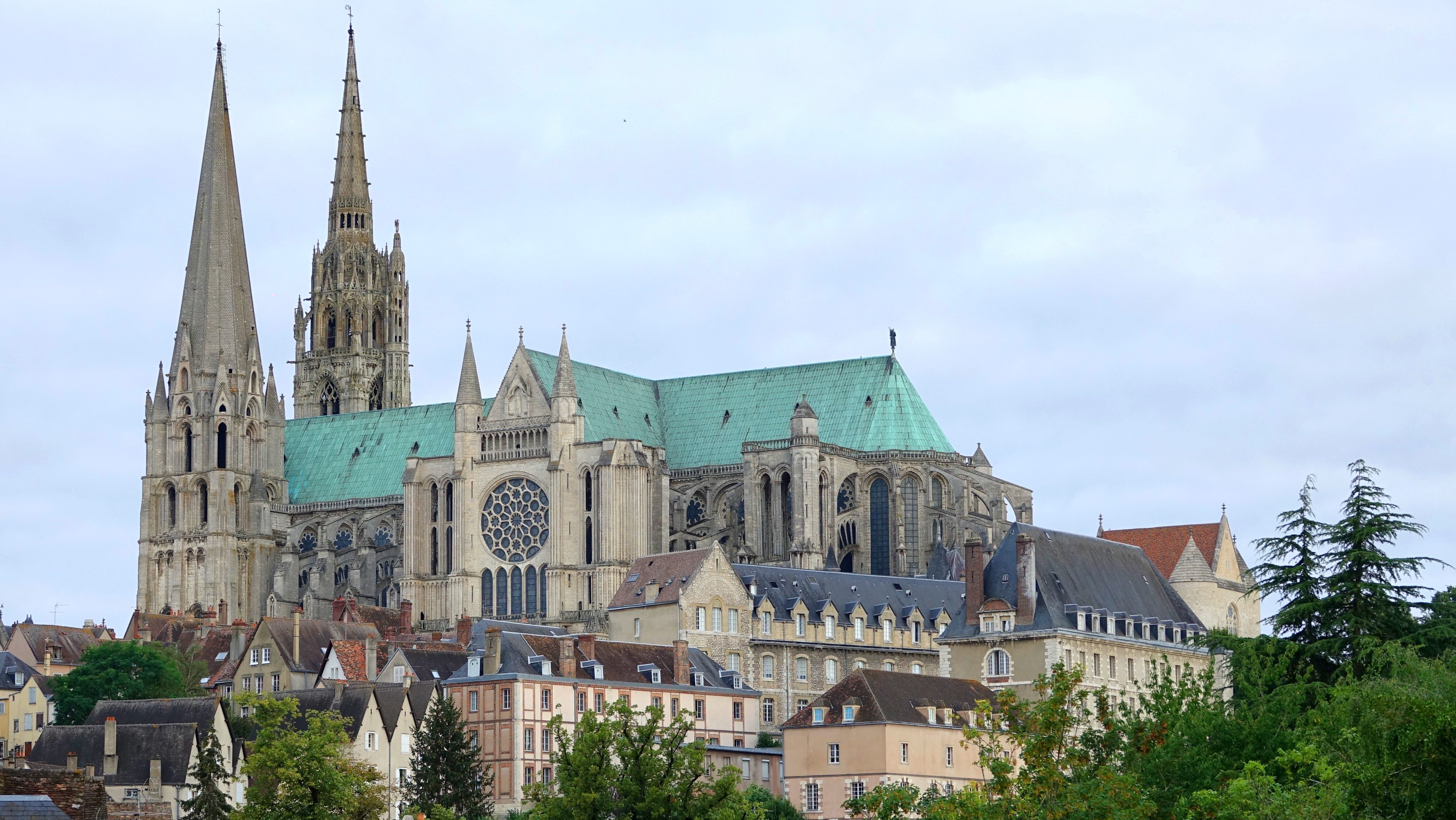 Chartres Cathedral towers over the historic town of Chartres, France, showcasing its stunning Gothic architecture and intricate stained glass windows.