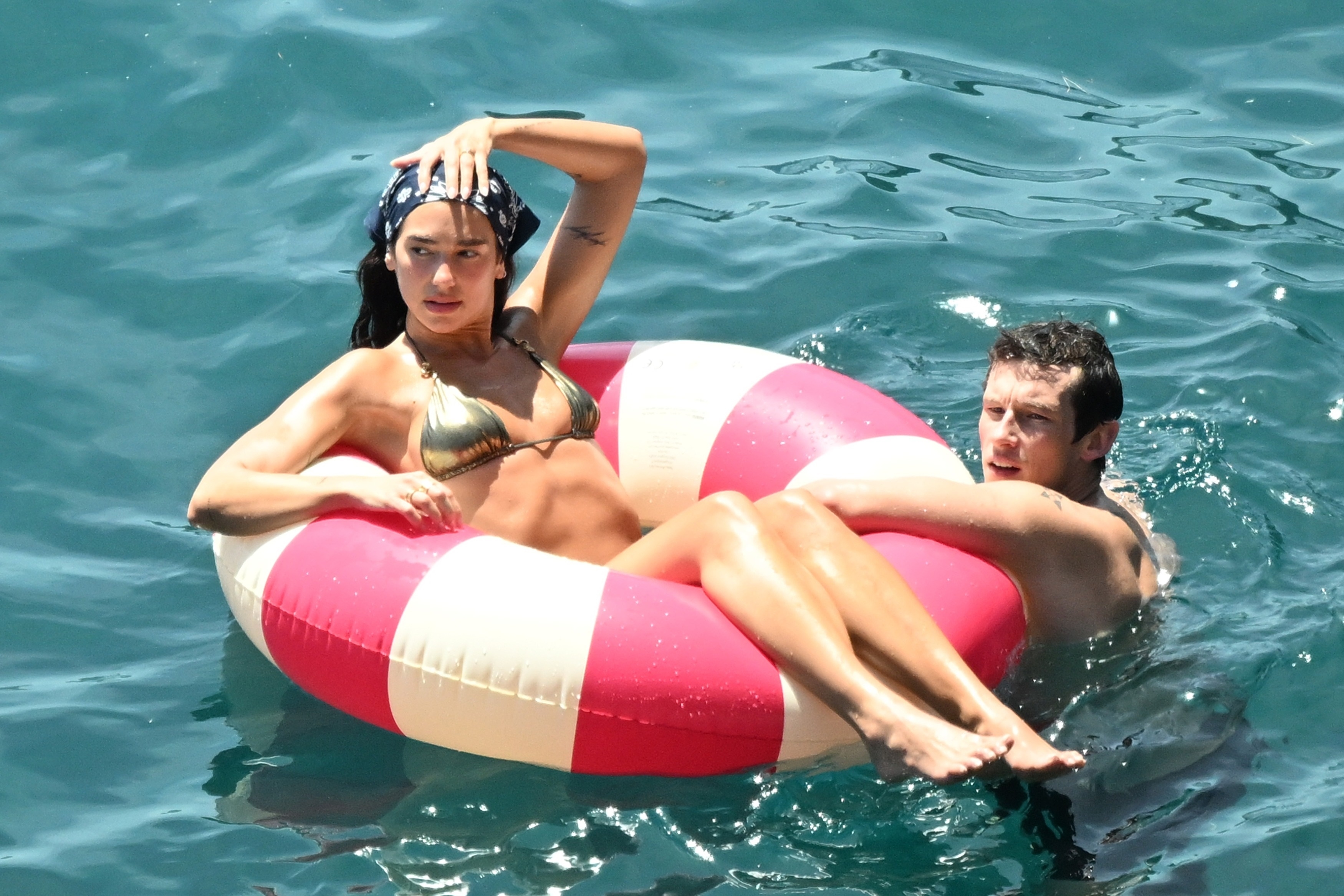 Dua Lipa and Callum Turner relaxing together on the Amalfi Coast during their honeymoon