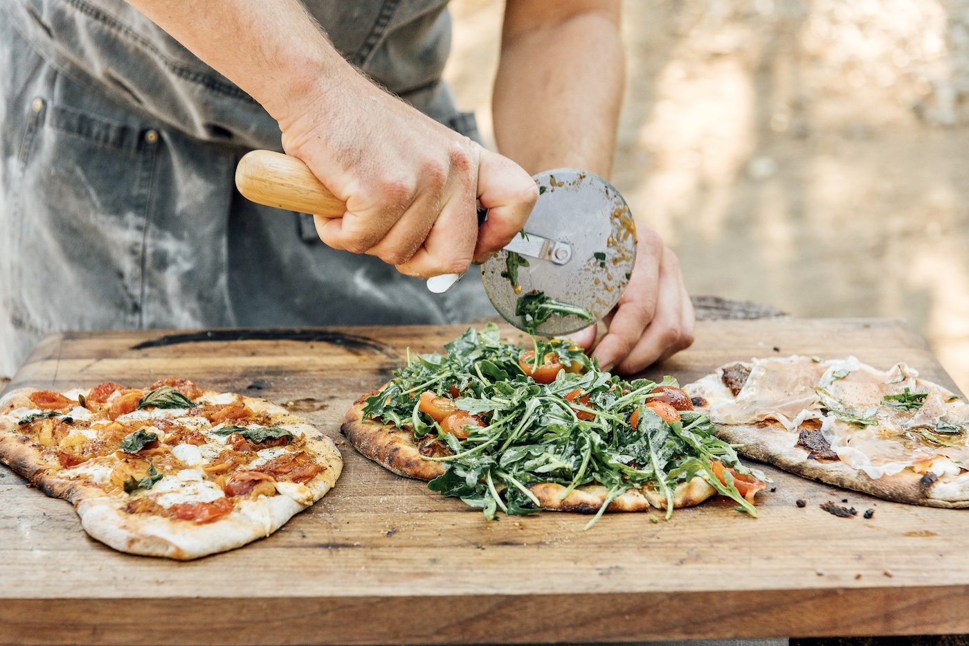 Hosting a Pizza Party Will Be The Most Fun You Have All Summer—Here’s Exactly How to Do It