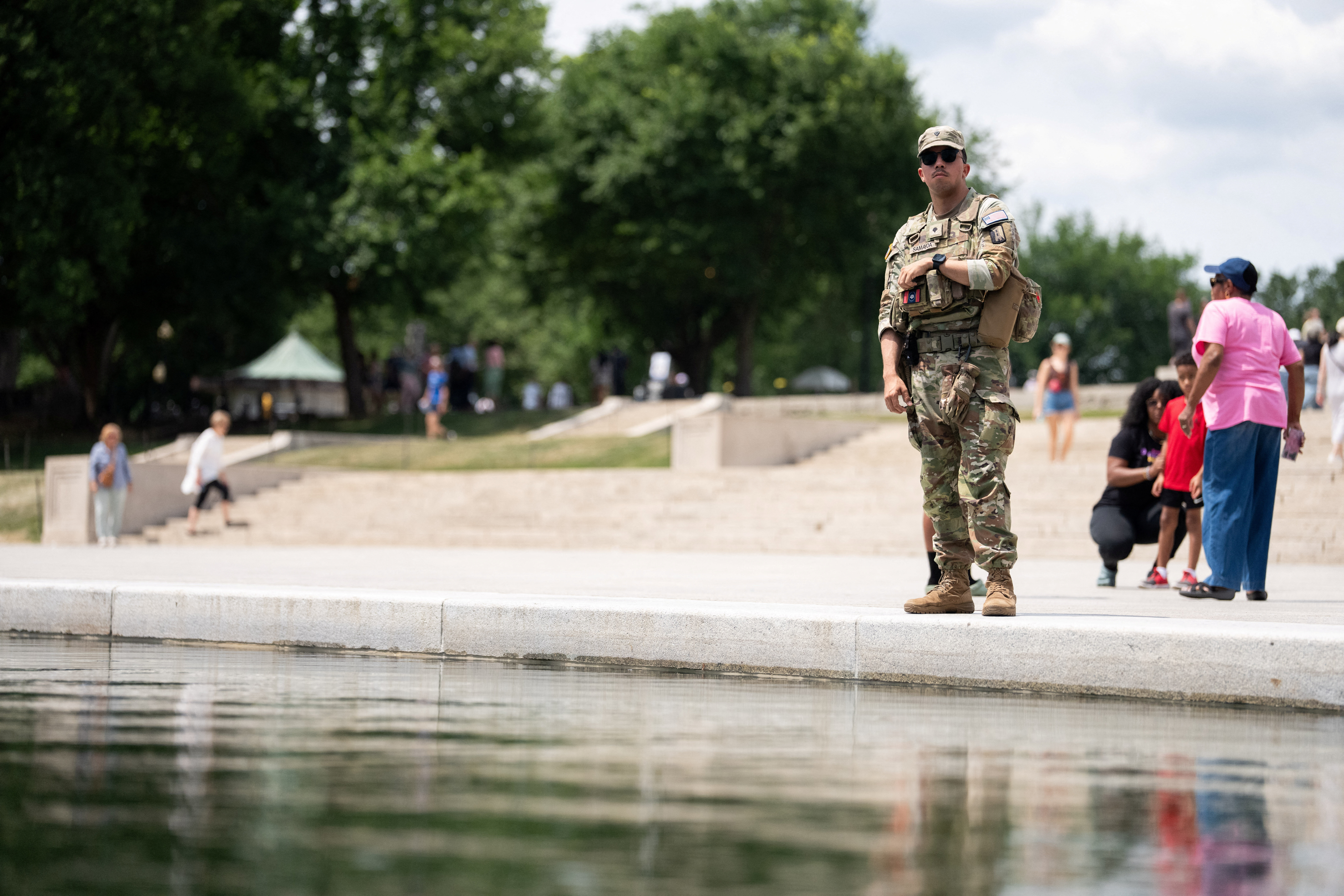 A National Guard member patrols the Lincoln Memorial Reflecting Pool in Washington, D.C.