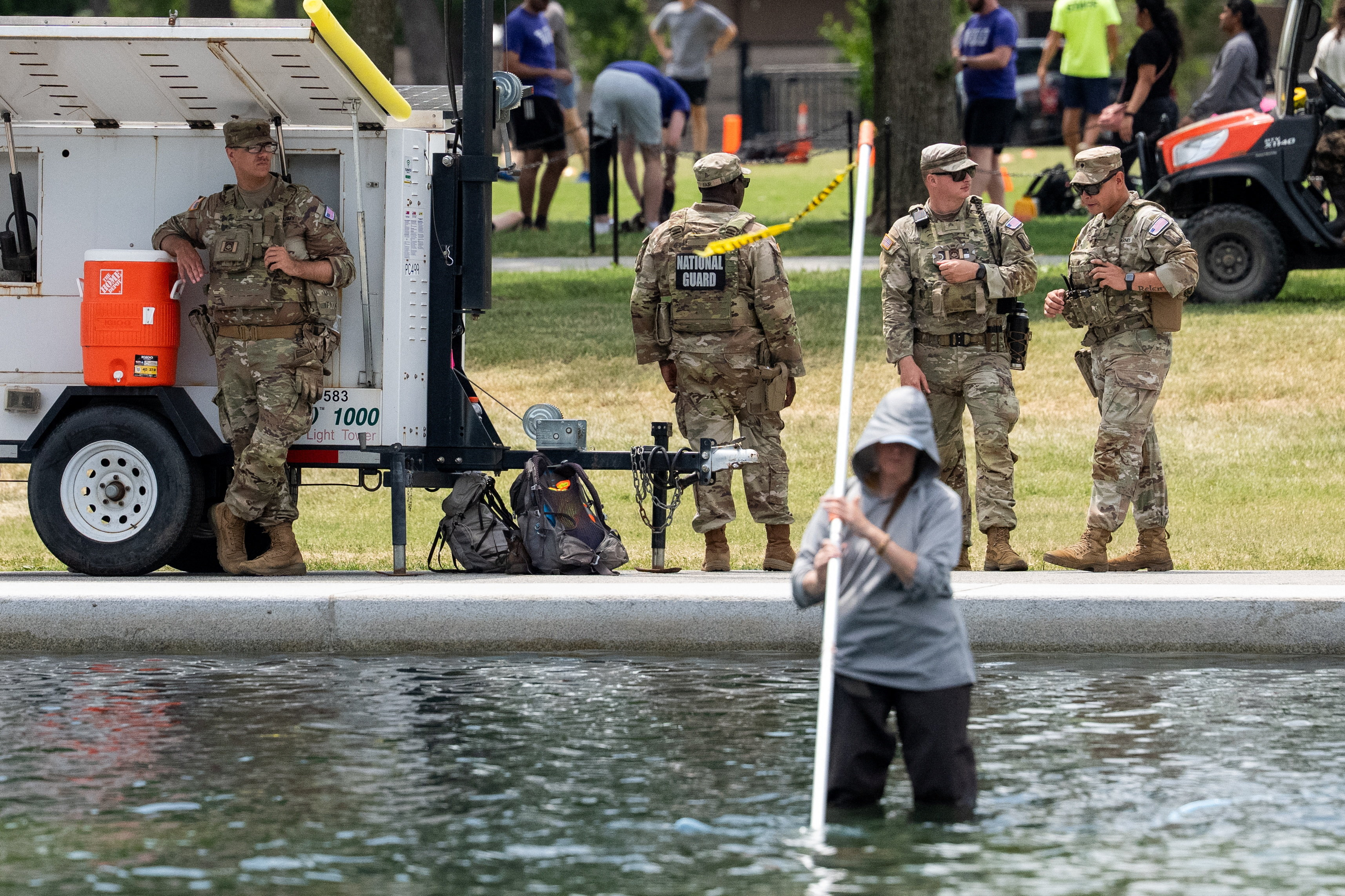 National Guard members patrolling the Lincoln Memorial Reflecting Pool in Washington, D.C.