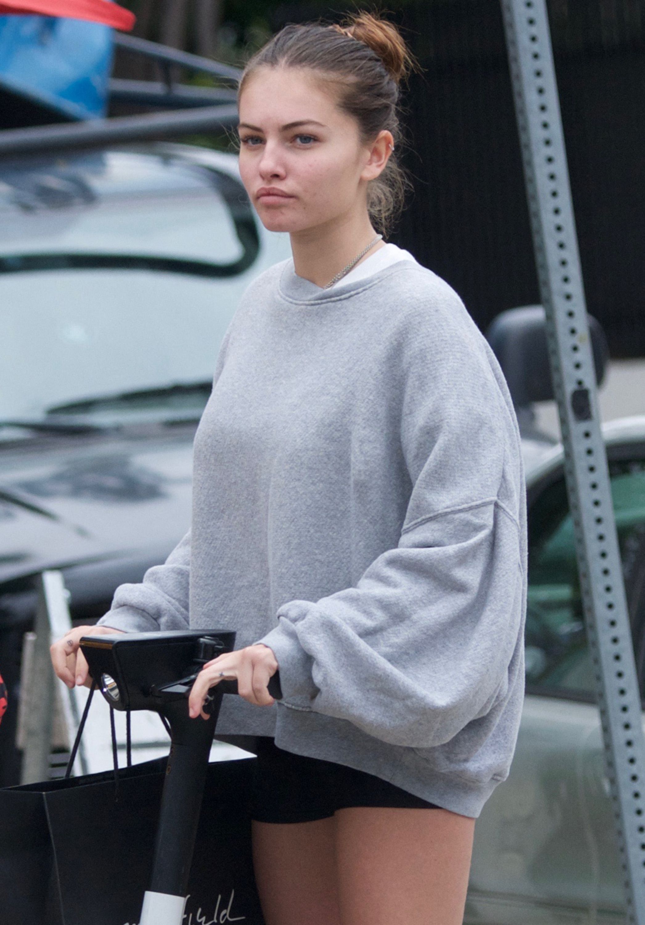 Thylane Blondeau and her boyfriend unlocking a Bird Scooter in Beverly Hills