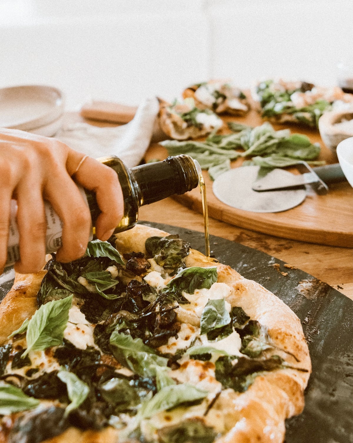 Camille Styles spinach and ricotta homemade pizza recipe baked in oven on pizza stone