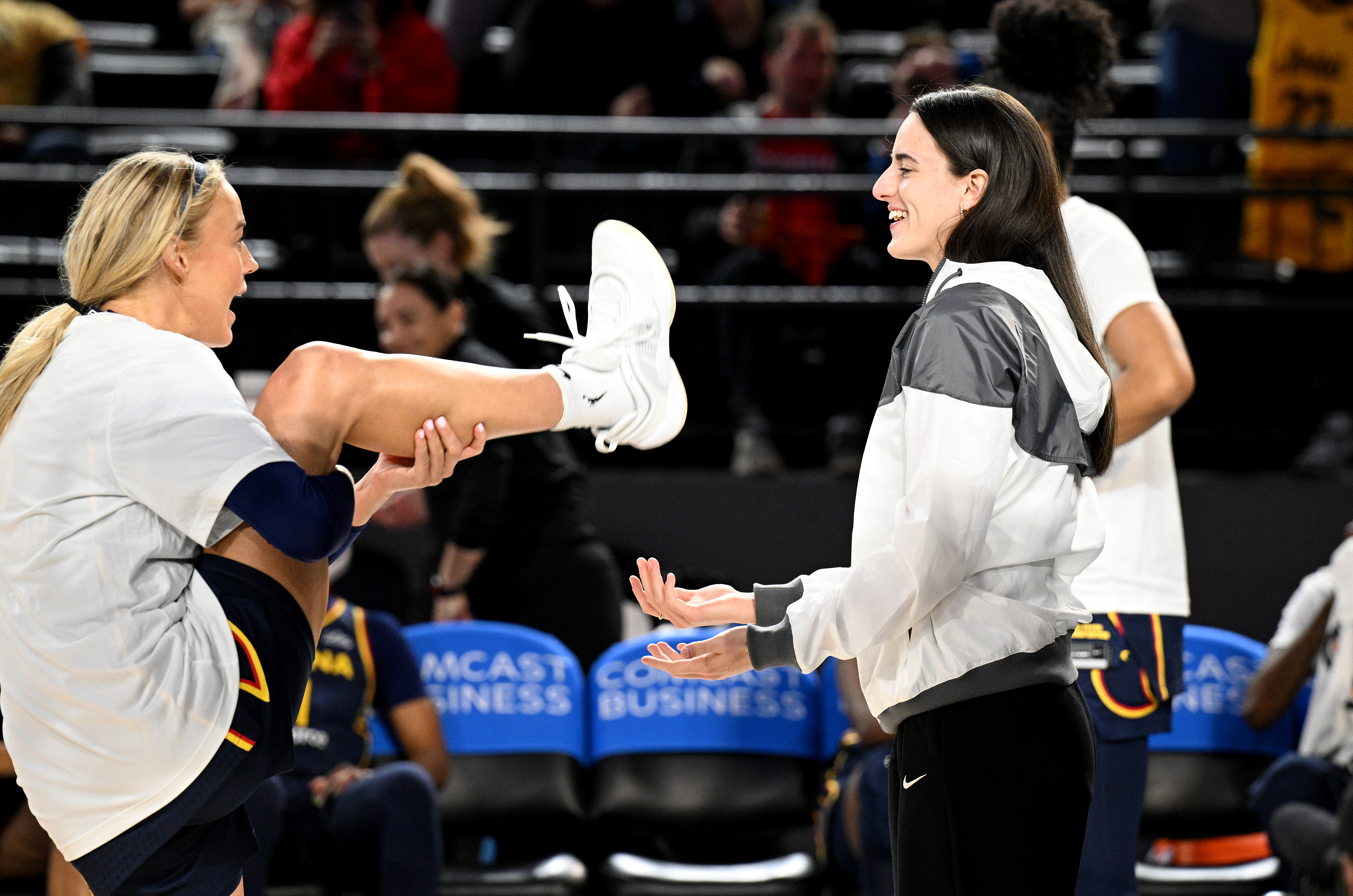 Sophie Cunningham and Caitlin Clark of the Indiana Fever on the court before a game against the Washington Mystics