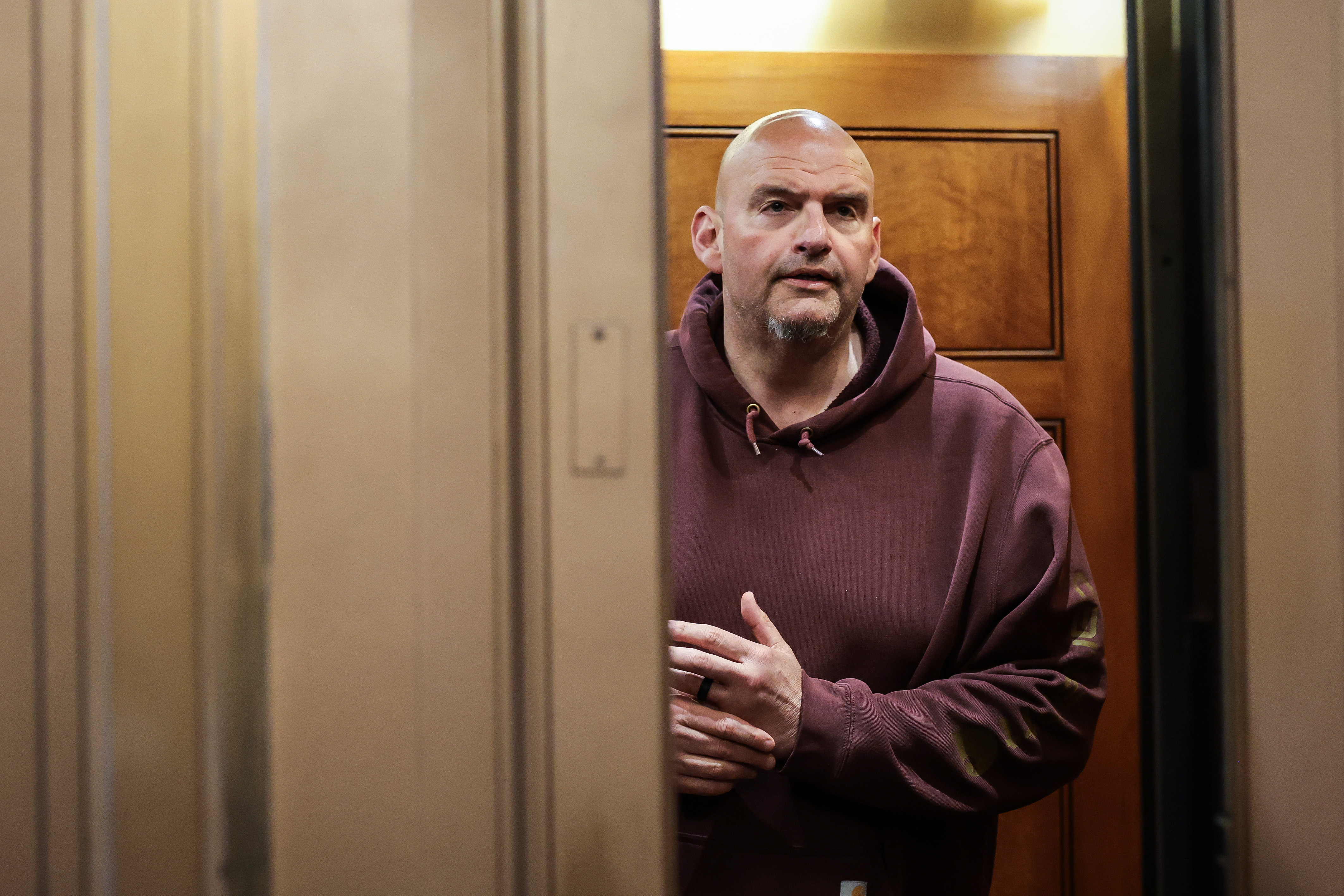 Sen. John Fetterman riding an elevator outside the Senate Chambers at the U.S. Capitol Building