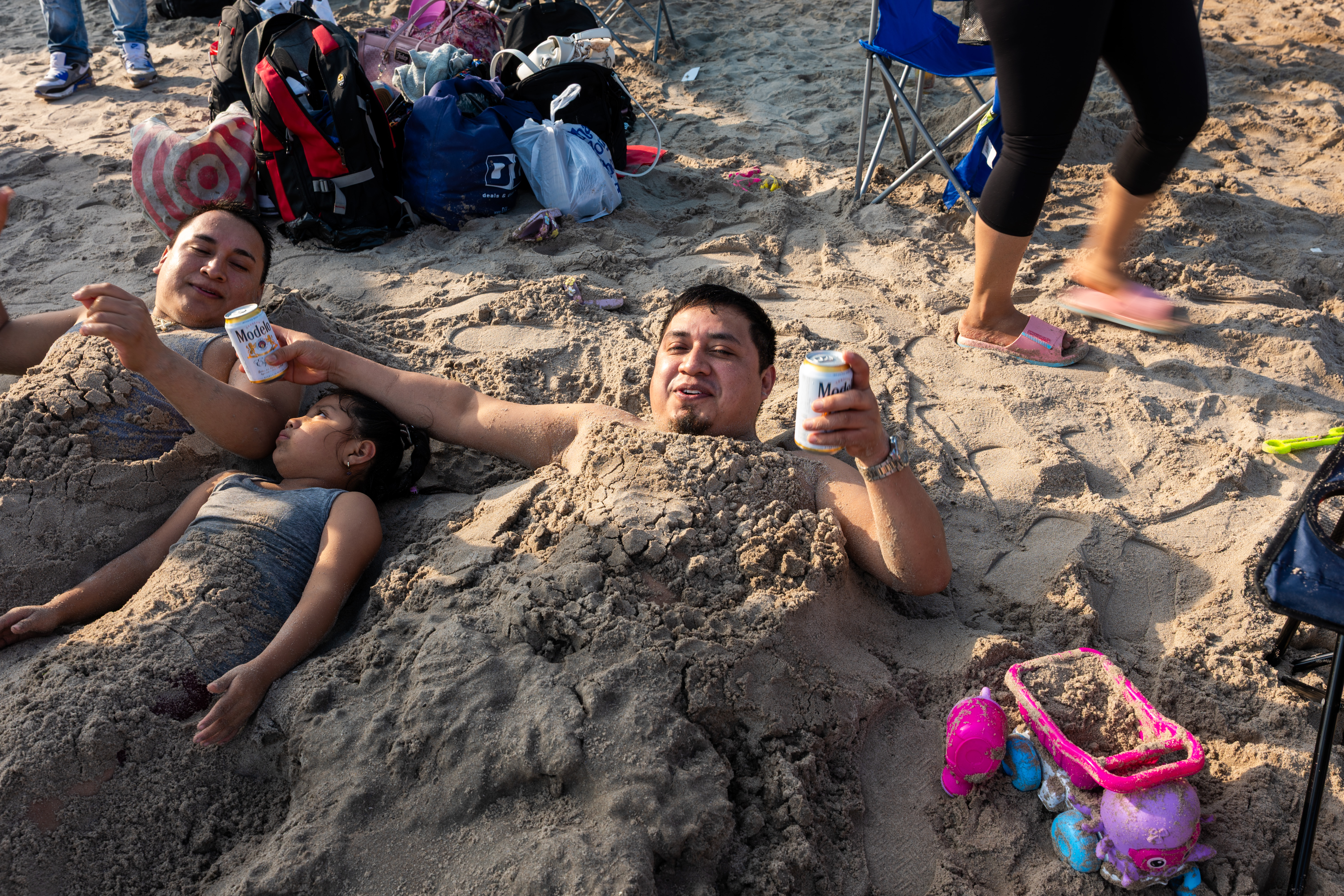 Crowds of people cooling off at Coney Island beach in Brooklyn during a heat wave