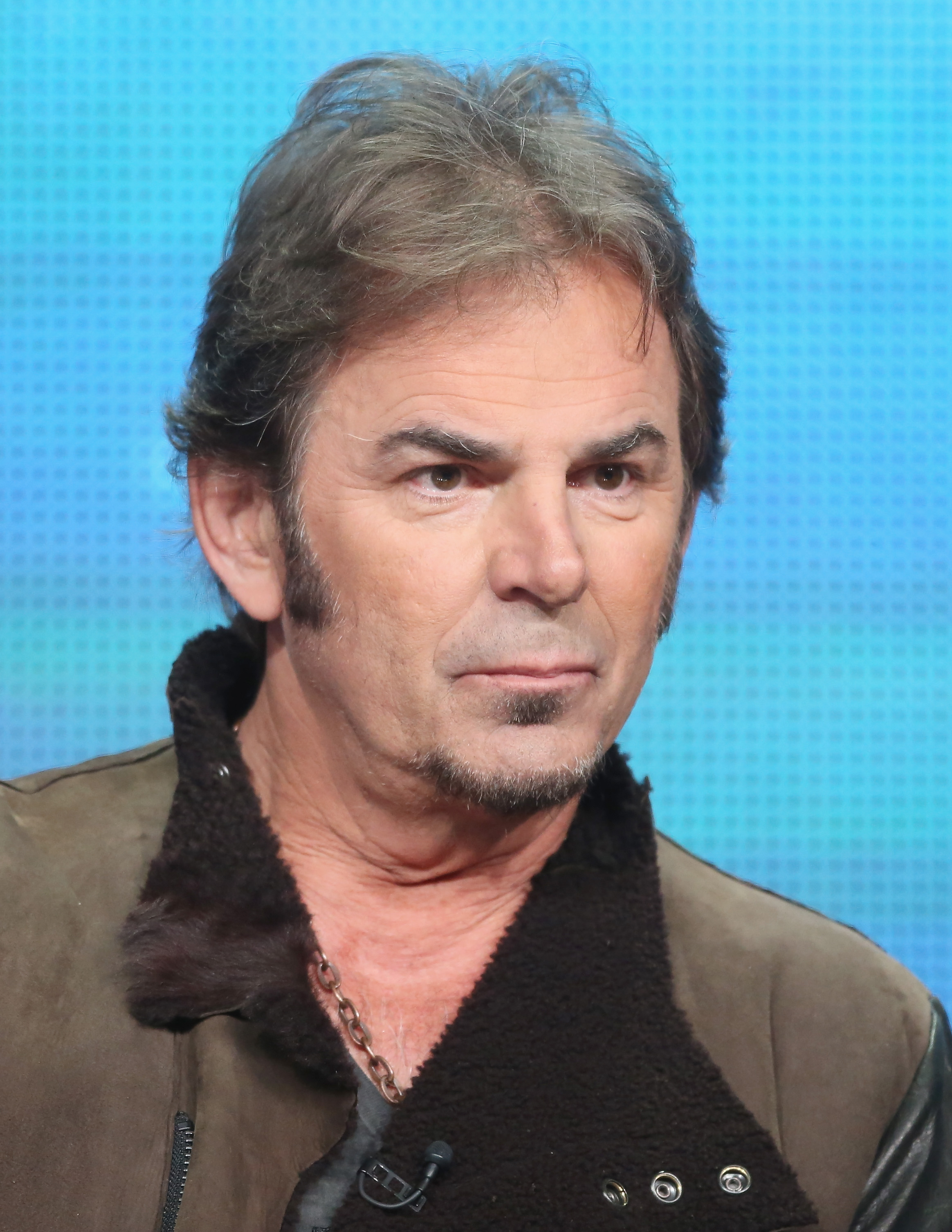 Jonathan Cain of Journey speaking onstage at a PBS panel during the 2013 Summer Television Critics Association Tour in Beverly Hills