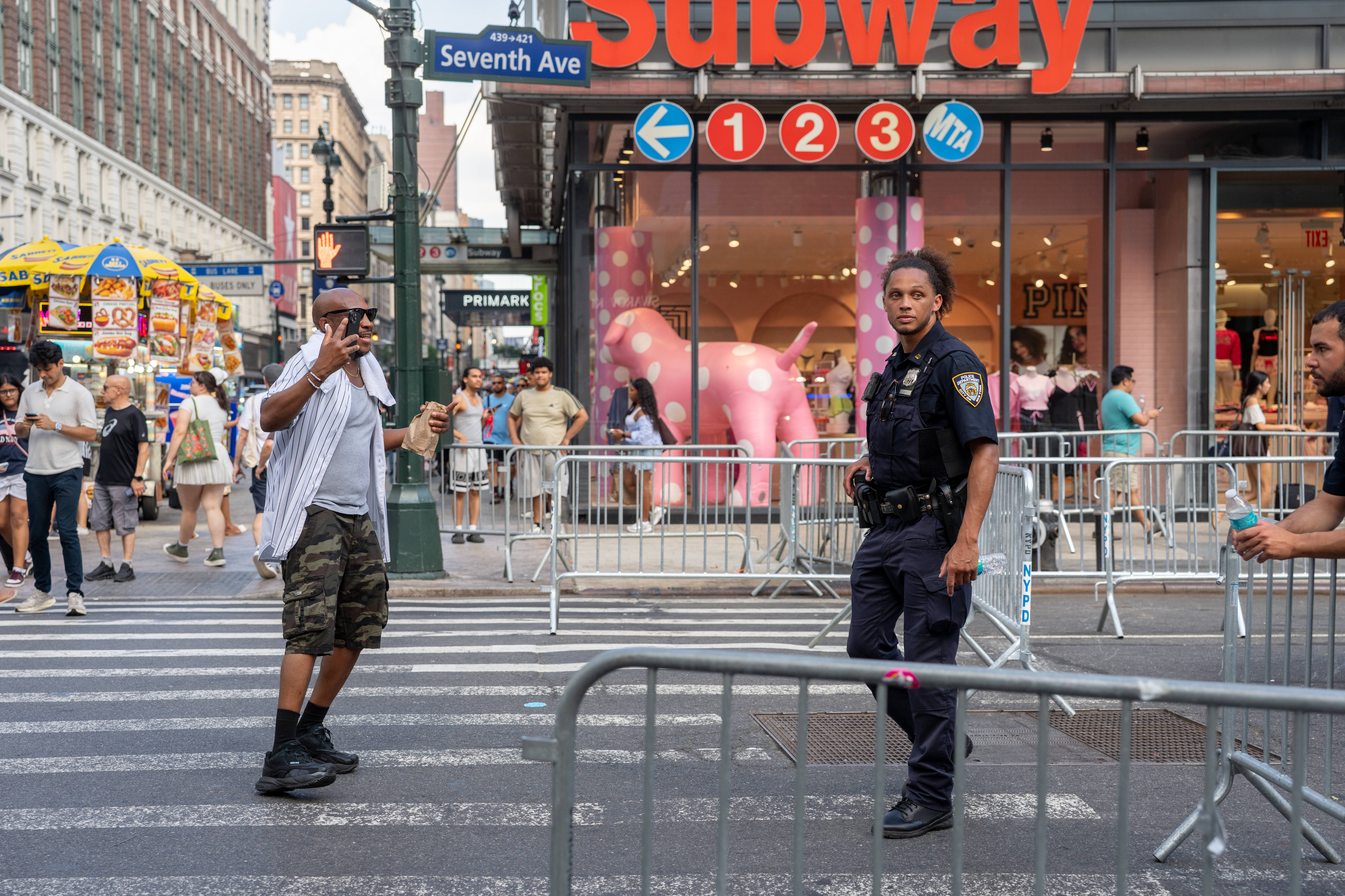 NYPD officers standing guard on a street closed to traffic near Madison Square Garden in New York City