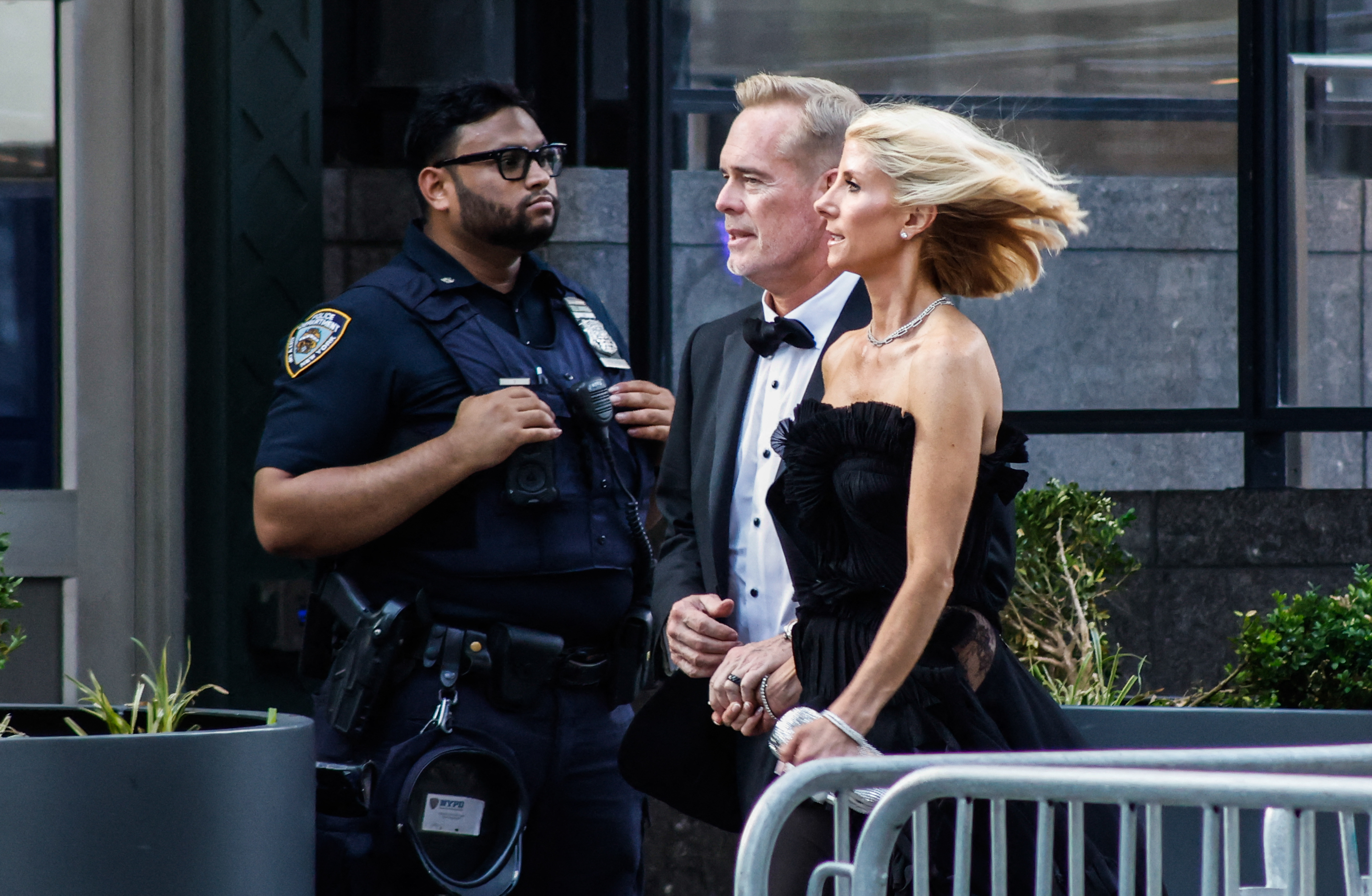 Joe Buck and Michelle Beisner-Buck arriving outside Madison Square Garden in New York City