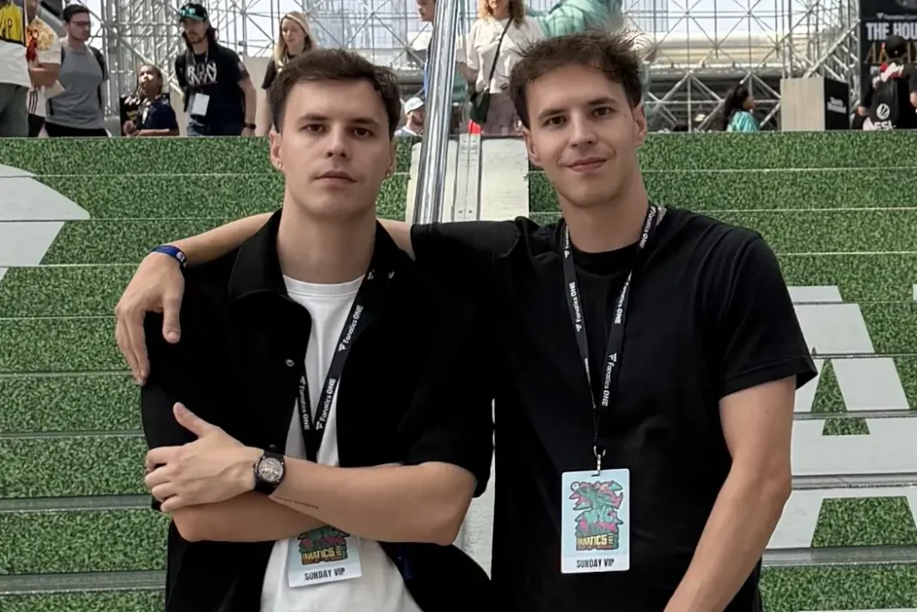 Martin and Josip Kristo stand together on a sports field