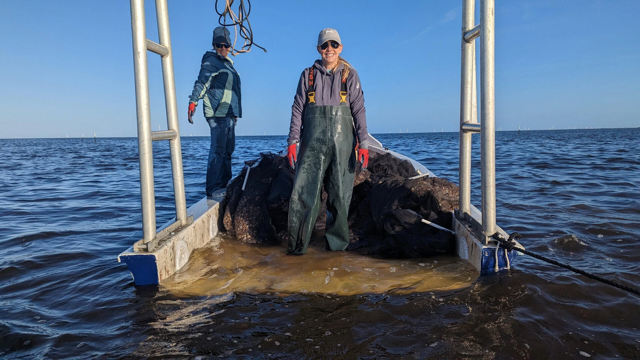 Clam farmer Tanya Fradella works on her clam boat in Cedar Key.
