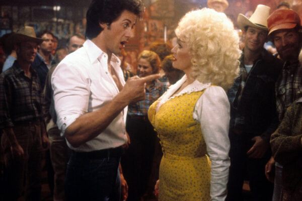Dolly Parton Says Making the Flop ‘Rhinestone’ with Sylvester Stallone “Got Me Back On Track” During One of the Darkest Periods of Her Life