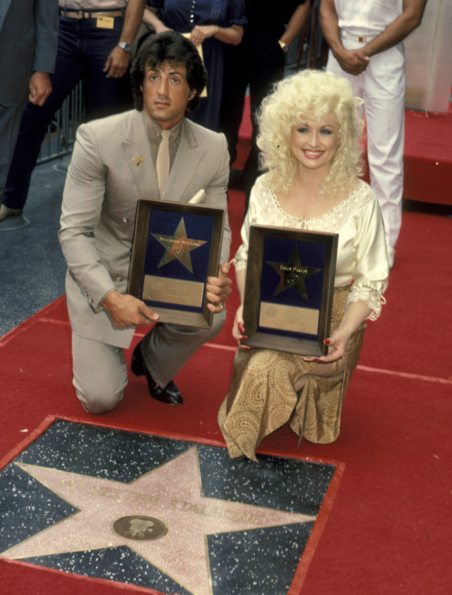Sylvester Stallone and Dolly Parton at their Hollywood Walk of Fame star ceremony in 1984