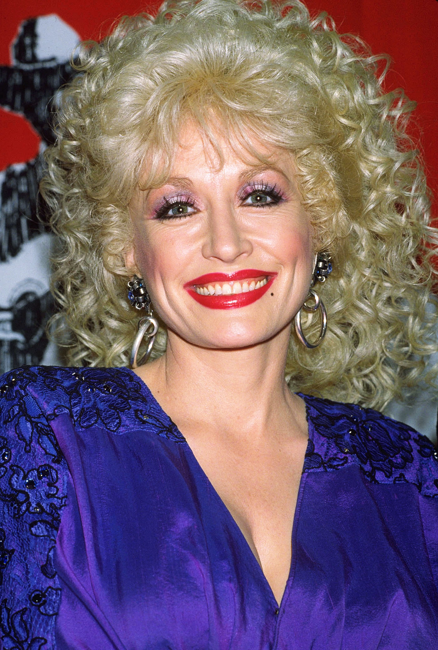 Dolly Parton posing in a file photo from 1999