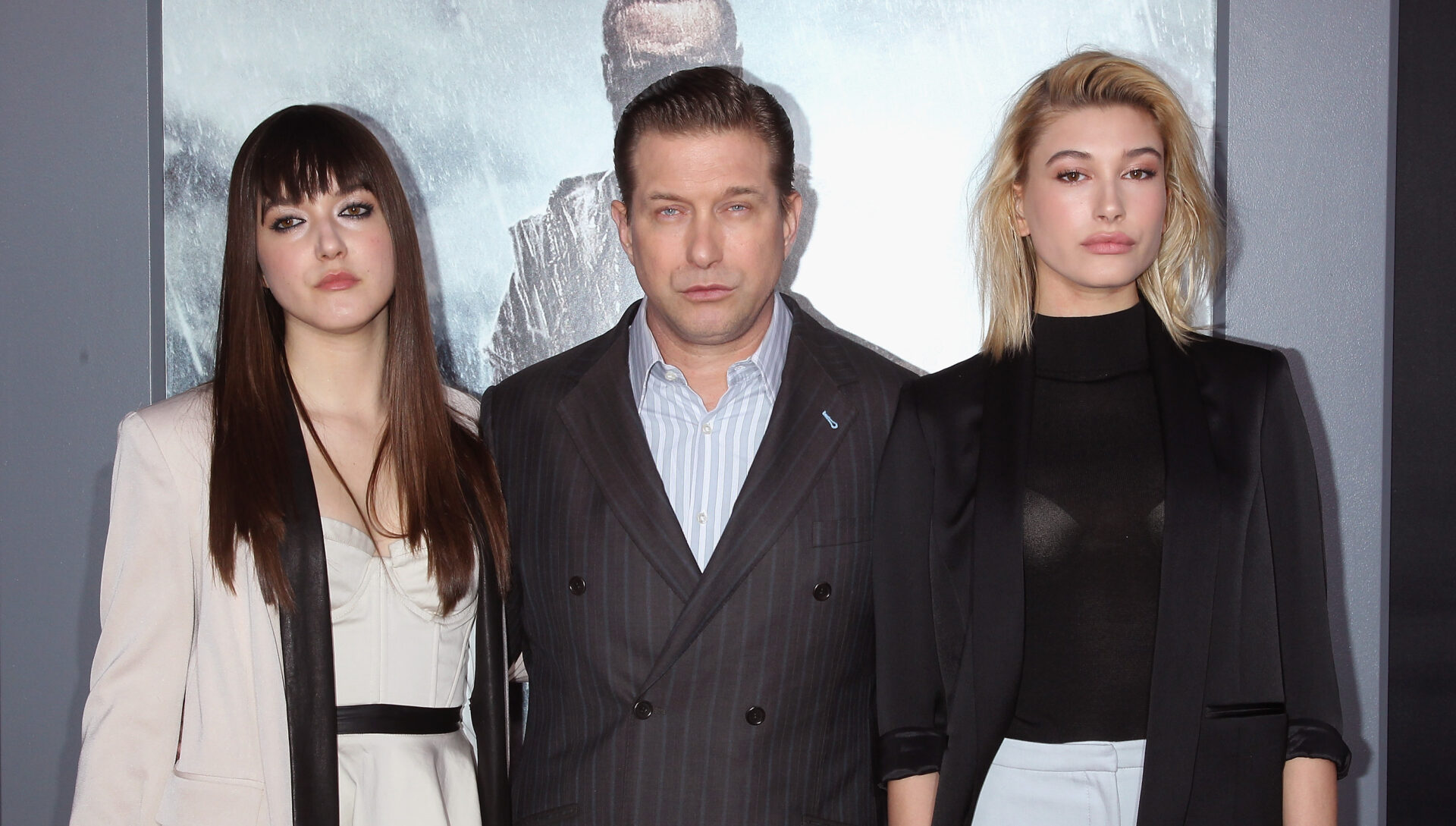 Alaia Baldwin, Stephen Baldwin, and Hailey Baldwin standing together on a red carpet at the Noah premiere in New York City, 2014.