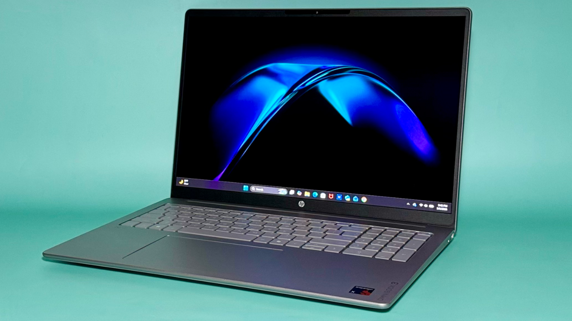 the hp omnibook 3 16 against an aqua background